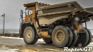 BELAZ trucks are crossing a road. БелАЗы пересекают автодорогу