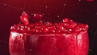 Pomegranate Grains falling on surface of half pomegranate in slow motion