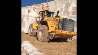 bulldozer going on 2 wheels while doing heavy job