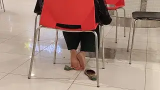 Candid shoeplay under chair in mall | Full video available