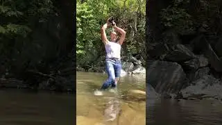 Light blue spray on jeans in the river