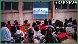 Mobile cinema brings movie magic to Syria Kurd children