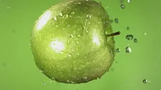 Flying of Green Apple in Green Background in Slow Motion