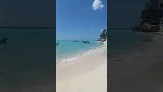 Barbados vibes:  sun-kissed sand, turquoise waters & colorful fishing boats