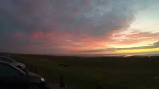 Sunset and off shore windfarm