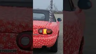 Stupid little miata wrapped in wrapping paper