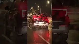 Kia Sonet in Black. Night view of Connected tail lights