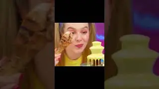 एक लड़की शेफ का चिकन चखती है।