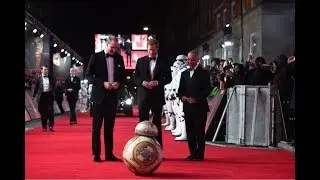 Prince William and Harry meet a mini robot at the Star Wars' Premiere