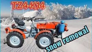 Трактор TZ-4K-14 чистит снег/Tractor TZ-4K-14 plowing snow