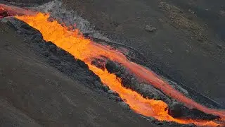 Lava flows down a steep hill into Meradalir , 10 July 2021 - Fagradalsfjall volcano - Iceland