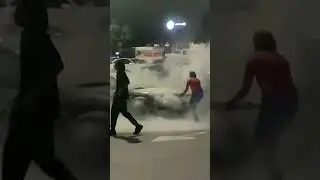 CAR LIGHTS UP IN FLAMES IN OPEN PARKING LOT😳