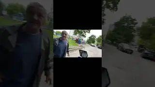 Redneck geezer harasses a motorcyclist. 
