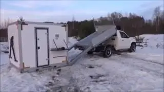 Mobile house for winter fishing. ice castle fish house.