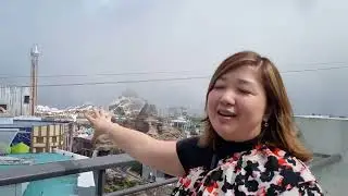 on top of a mountain and on top of a balcony in Genting