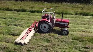 International & PZ mowing hay