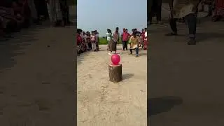 Who can pop the balloon throwing dart ??