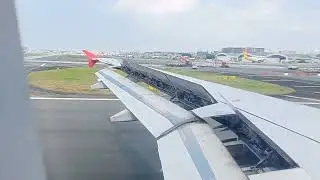 Airplane landing view. Bohol, Panglao International Airport to Manila Domestic Airport.