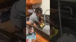 They got the baby IN THE SINK washing dishes!