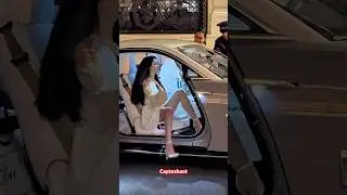 MODEL ANDREEA SASU WITH PHILIPP PLEIN IN ROLLS ROYCE SPECTRE 