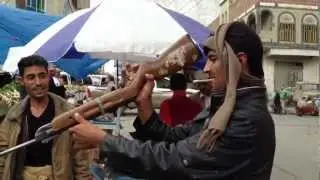 Yemen Life - Shooting rifle upside down اليمن - اب Ibb 2013