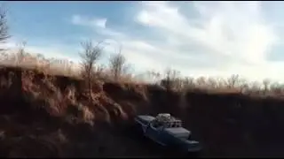 feed truck going up the creek bank