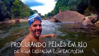 Searching for fish in CRYSTAL CELAR WATER RIVER with a waterfall, in Caparaó, ES - BRAZIL