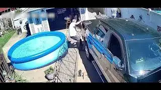 Guy falls backwards into kiddie pool