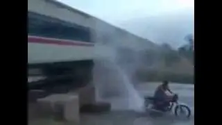 washing the train by bike