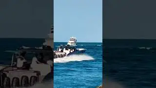 Super fast cigarette boat leaving Haulover Inlet