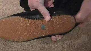 Changing into vintage 1960s black plimsolls  ( canvas sneakers ) Woolworths