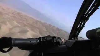 Kiowa Helicopters Fire Rockets and .50 Cal Machine Gun