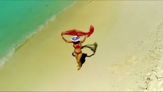 Maldives, Sun Island,  a girl on the beach, honeymoon, shooting from a quadrocopter.  2/4