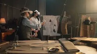Tailors wearing VR headset with controllers