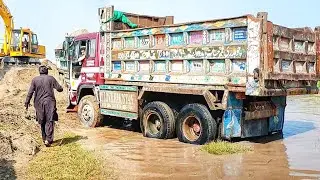 Challenging Recovery: Truck Dumper Submerged in Deep Waters