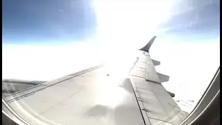 in airplane over the clouds at sunshine