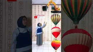 Pop a air balloon filled with bulldozer 