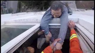 Fireman saves man from falling out of the window