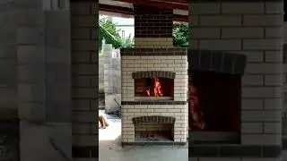 Уличная печь под навесом для дачи