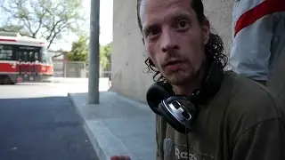 Jeffrey stood out sitting on the curb typing into a laptop. He is homeless in Toronto.