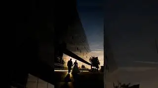 Using Building & Sunset to create Silhouette Wedding Photograph of Bride & Groom
