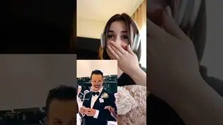 Girl reacting to funny  wedding video