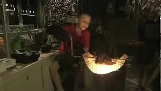 Small Child TENDERISIES the RAW chicken