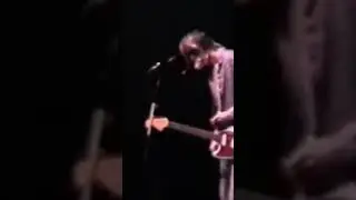 What does Kurt Cobain pick up off the ground?