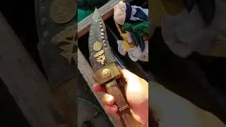 Amateur restoring a rusted Nepal kukri knife
