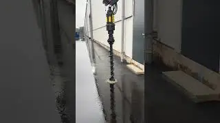 Digga drill drills through asphalt in the port of Rotterdam.