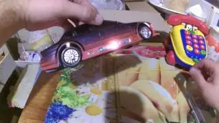 Игрушечный секонд хенд - музыкальная машина и телефон каталка