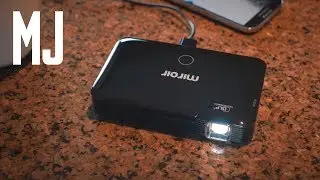 This HD Movie Projector Can Fit in Your Pocket | Men's Journal
