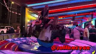 Two Cool Girls Riding on a Bull in Benidorm   Bull Riding 4K