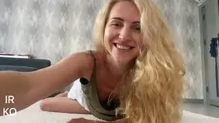 Exercises for slender legs | Girl with long hair raises her legs in short shorts | cheerful girl